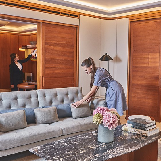 Maids cleaning in suite